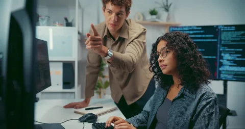 Diverse team software developer discuss AI coding and project at office. Stock Footage 343928438