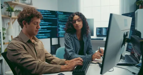 Diverse team software developer discuss AI coding and project at office. Stock Footage 343928979