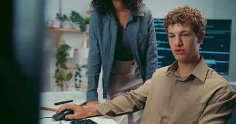 Diverse team software developer discuss AI coding and project at office. Stock Footage 343929797