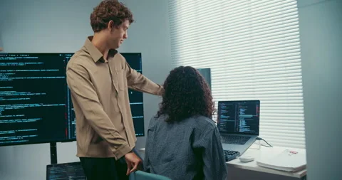 Diverse team software developer discuss AI coding and project at office. Stock Footage 343929812
