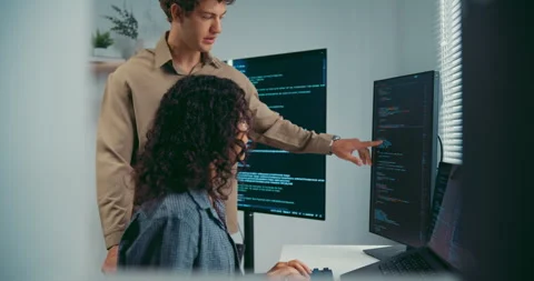 Diverse team software developer discuss AI coding and project at office. Stock Footage 343929826