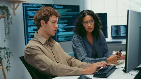 Diverse team software developer discuss AI coding and project at office. 動画素材 347151546
