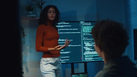 Diverse team software developer present coding to colleague at office night. Vídeos de archivo 347149041