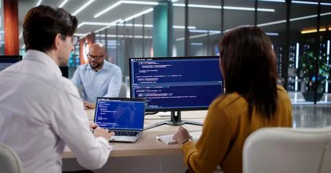 Diverse Team Of Software Developers Coding And Meeting In Modern Office. Prog Stock Photos