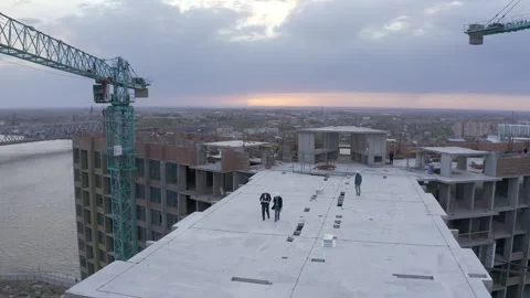 Diverse Team of Specialists Talking On the Skyscraper Formwork Construction Site Stock Footage 321004600