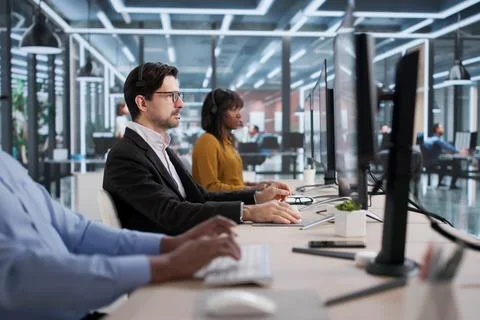 Diverse Team Of Support Agents Answering Calls And Helping Customers Remotely Stock Photos