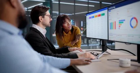 Diverse Team Uses CRM Software For Sales And Marketing Training. The Woman An Stock Photos