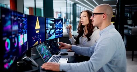 Diverse Team Using Digital Dashboard To Analyze Error In Data. Stock Photos