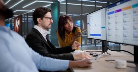 Diverse Team Using Software For Payroll, Tax Reports, And Financial Tracking Stock Photos