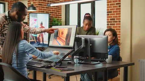 Diverse team of women developing machine component on cad software Foto stock