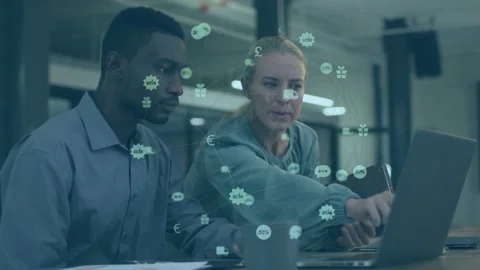 Diverse team working at office desk, woman pullover holding tablet pointing at Stock Footage 333078058