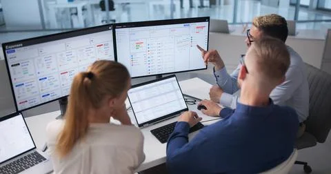 Diverse Team Works Together Using Cloud Software For Financial Forecasting. Stock Photos