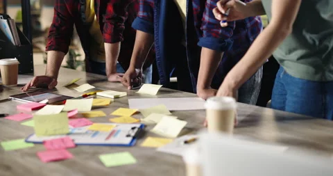 Diverse team of young office workers having brainstorming session, energetically Stock-Footage 158704515