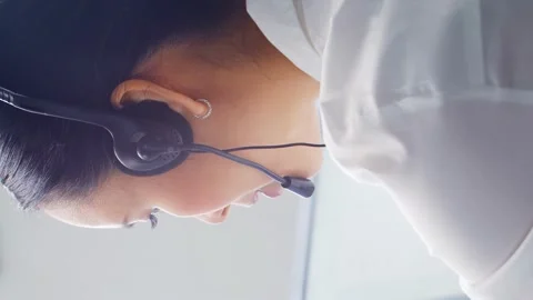 Diverse team of young professionals is working in the phone support office Stock Footage 269681833