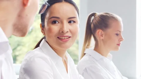 Diverse team of young professionals is working in the e-mail support center Stock-Footage 273848341
