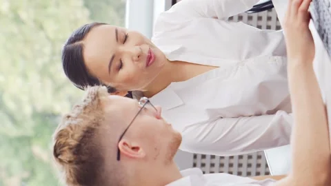 Diverse team of young professionals is working in the e-mail support center Stock Footage 273848816