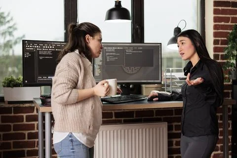 Diverse tech enginners developing software algorithm Photos