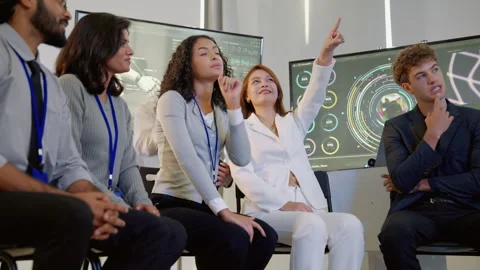 Diverse Technology Team Discussing Data and Digital Innovation in Modern Office Stock Footage 348336216