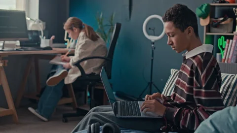 Diverse Teenagers Studying Scripting Codes in Home Workspace Stock Footage 319732353