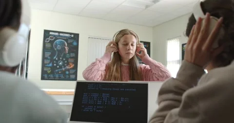 Diverse teens in class starting, female teen putting white headphones adjusting Stock Footage 340656043