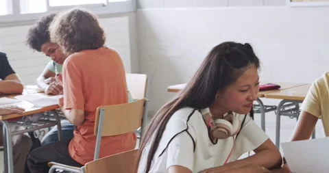 Diverse teens work as a team in class at high school. Education, diversity Stock Footage 157731504