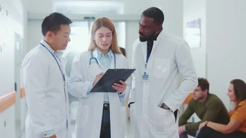 Diverse three multi-cultural doctors negotiating discussing therapy medication Video stock 142591120
