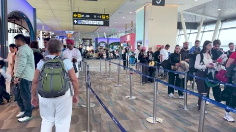 Diverse Travelers Waiting in Long Queue at Phuket International Stock Footage 329201230
