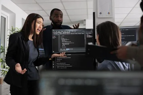 Diverse web developers collaborating about programming project Stock Photos