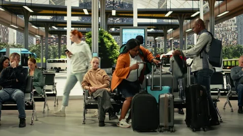 Diverse women involved in aggressive argument at busy bus terminal Stock Footage 334724318
