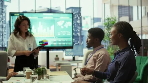 Diverse work team collaborating on project management tasks Stock Footage 318229071