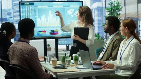 Diverse work team collaborating on project management tasks Stock Photos