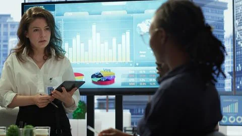 Diverse work team collaborating on project management tasks Stock Photos