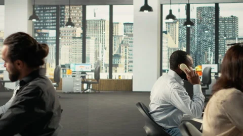 Diverse work team in a multinational company reviews analytics, Stock Footage 320030664