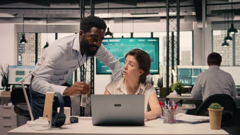 Diverse work team in a multinational company office discussing forecasting Stock Footage 329332808