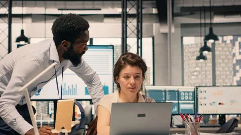 Diverse work team in a multinational company office discussing forecasting Stock Photos