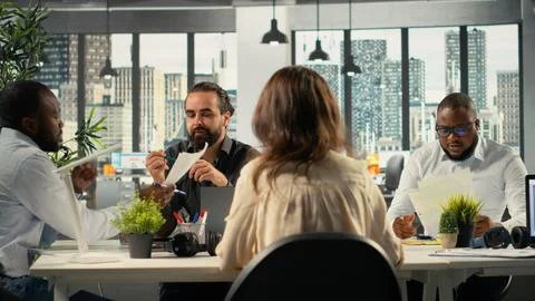 Diverse work team in multinational company analyzing metrics and projections Stock Photos