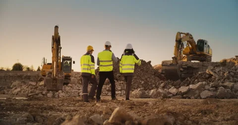 Diverse Workers Using Tablet On Construction Site Stock Footage 256042635