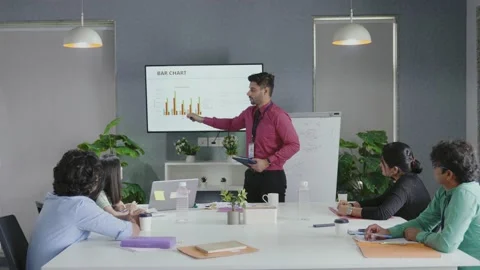 Diverse Young Entrepreneurs, Talking, Using TV with In for graphics. Stock-Footage 168348820