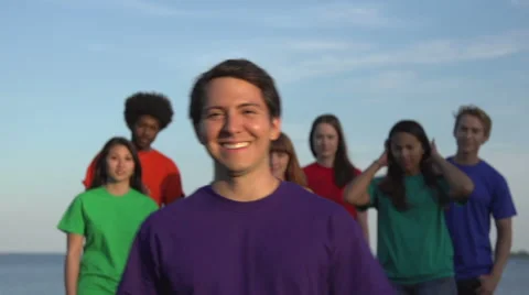Diverse young group run to camera and smile - speed ramped Stock Footage 44105220
