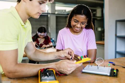 Diverse young school students learning electronic at technology class 스톡 사진
