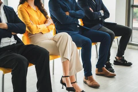 Diversity candidates siting while waiting for job interview. Intellectual. 库存照片