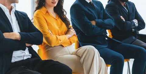 Diversity candidates siting while waiting for job interview. Intellectual. 库存照片