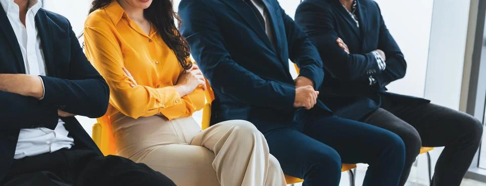 Diversity candidates siting while waiting for job interview. Intellectual. Stock Photos