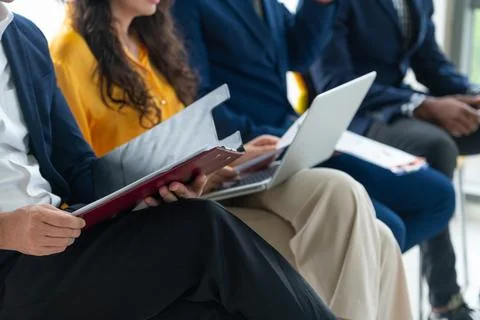 Diversity candidates siting while waiting for job interview. Intellectual. Stock Photos