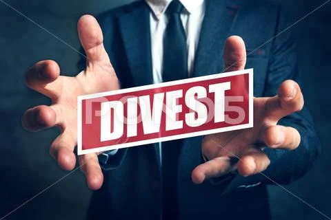 Divestment concept with businessman in suite Stock Photos