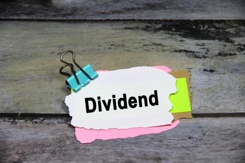 Dividend wording or text on white paper with grey background.Copy space and.. Stock Photos