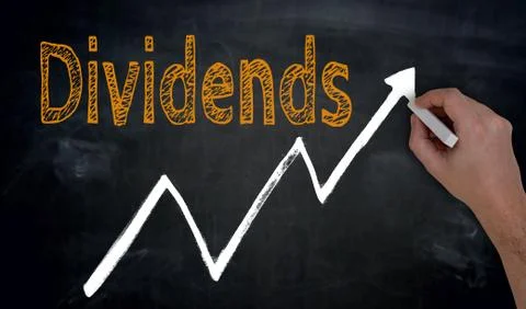 Dividends and graph is written by hand on blackboard Stock Photos