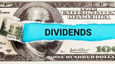 Dividends. The word Dividends in the background of the US dollar. Investment Inc Stock Photos