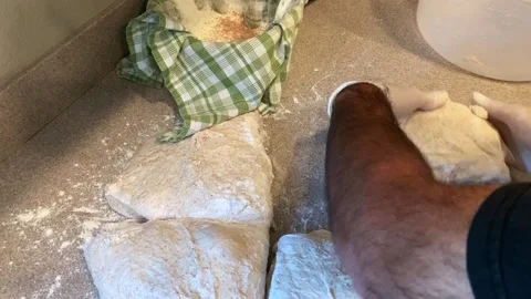 Dividing Up and Rolling Out Bread Dough Stock Footage 134215068