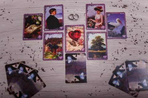 Divination cards alignment in the heart shape for love and family. Stock Photos